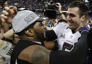 Baltimore Ravens linebacker Ray Lewis and quarterback Joe Flacco celebrate their 34-31 win against the San Francisco 49ers in Super Bowl XLVII at the Mercedes-Benz Superdome in New Orleans on Sunday, Feb. 3, 2013.